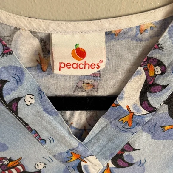 Peaches Uniforms Light Blue Penguin Print Scrub Top - Picture 2 of 4